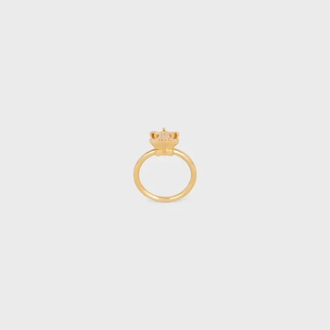 Anillo solitario Triomphe con brillos de strass y latón con acabado dorado Anillo solitario Triomphe con brillos de strass y latón con acabado dorado