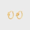 Aros pequeños Knot en latón con acabado dorado Aros pequeños Knot en latón con acabado dorado