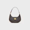 Bolso Ava Triomphe mediano en Triomphe Canvas y piel de becerro Bolso Ava Triomphe mediano en Triomphe Canvas y piel de becerro