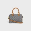 Bolso Boston pequeño en jacquard Triomphe y piel de becerro Bolso Boston pequeño en jacquard Triomphe y piel de becerro