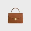 Bolso Nino mediano en piel de becerro nobuk Bolso Nino mediano en piel de becerro nobuk
