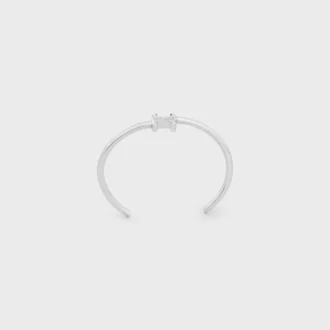 Brazalete asimétrico Triomphe en latón con acabado en rodio
