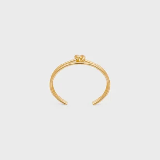 Brazalete doble con nudo en latón con acabado dorado