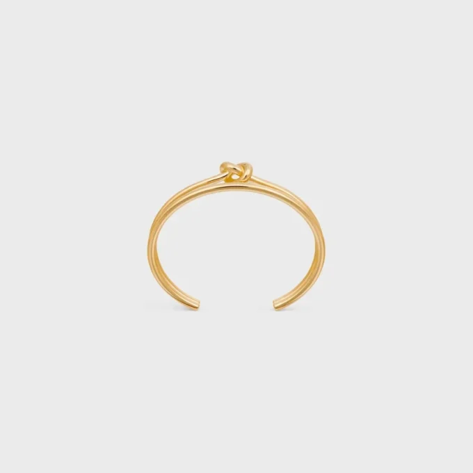 Brazalete doble con nudo en latón con acabado dorado