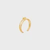 Brazalete doble con nudo en latón con acabado dorado