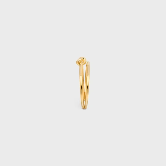 Brazalete doble con nudo en latón con acabado dorado