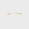 Broche tipo alfiler de seguridad con charms, de latón con acabado dorado Broche tipo alfiler de seguridad con charms, de latón con acabado dorado