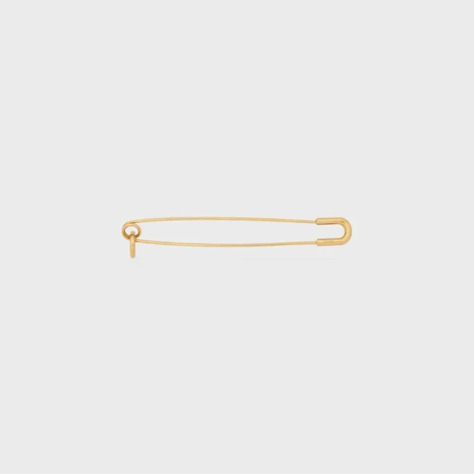 Broche tipo alfiler de seguridad con charms, de latón con acabado dorado Broche tipo alfiler de seguridad con charms, de latón con acabado dorado