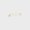 Broche tipo alfiler de seguridad con charms, de latón con acabado dorado Broche tipo alfiler de seguridad con charms, de latón con acabado dorado