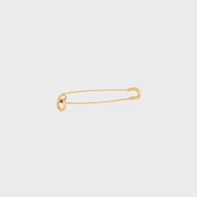Broche tipo alfiler de seguridad con charms, de latón con acabado dorado Broche tipo alfiler de seguridad con charms, de latón con acabado dorado