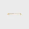 Broche tipo alfiler de seguridad con charms, de latón con acabado dorado Broche tipo alfiler de seguridad con charms, de latón con acabado dorado