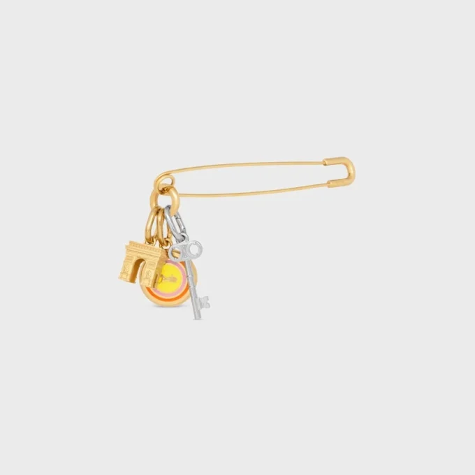 Broche tipo alfiler de seguridad con charms, de latón con acabado dorado Broche tipo alfiler de seguridad con charms, de latón con acabado dorado