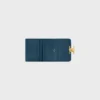 Cartera compacta con monedero Triomphe en piel de becerro brillante