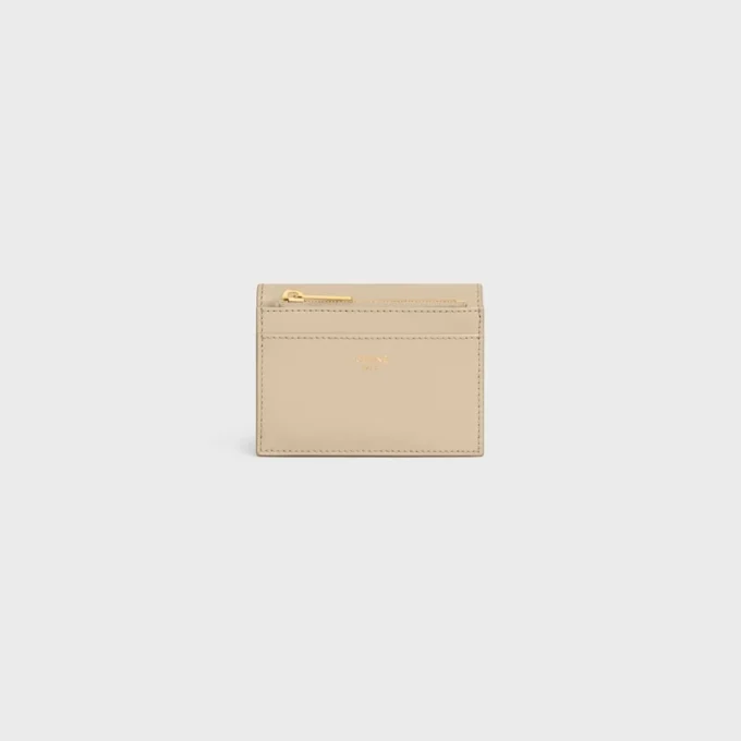 Cartera compacta con monedero Triomphe en piel de becerro brillante