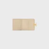 Cartera compacta con monedero Triomphe en piel de becerro brillante
