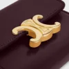 Cartera compacta con monedero Triomphe en piel de becerro brillante