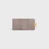 Cartera compacta con monedero Triomphe en piel de becerro brillante