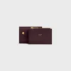 Cartera compacta con monedero Triomphe en piel de becerro brillante