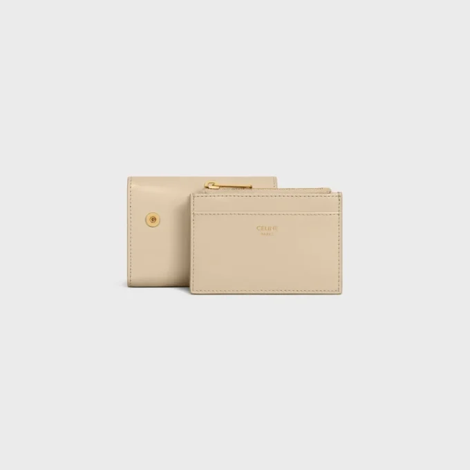 Cartera compacta con monedero Triomphe en piel de becerro brillante