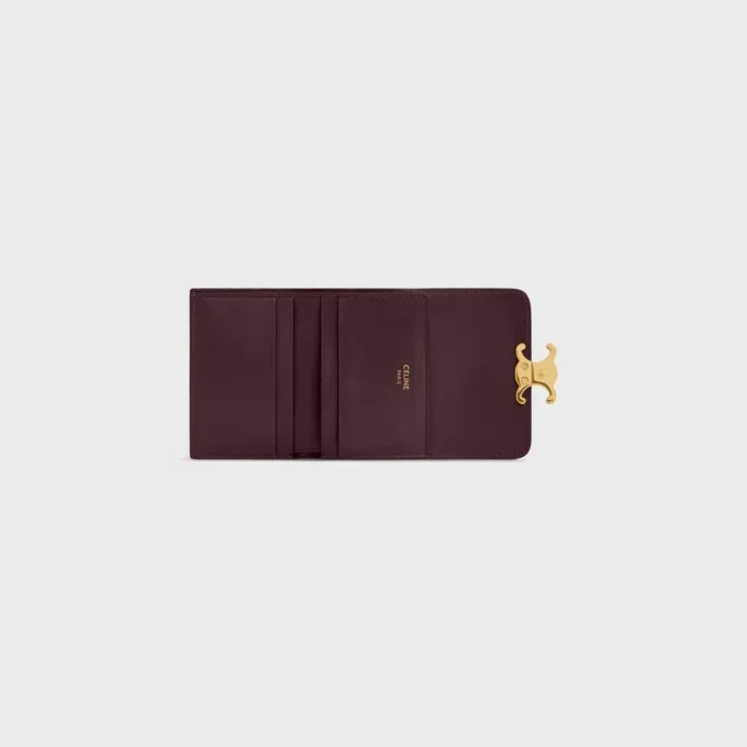 Cartera compacta con monedero Triomphe en piel de becerro brillante