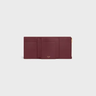 Cartera Nino con correa fina en piel de becerro granulada y flexible