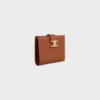 Cartera Nino de correa mediana en piel de becerro granulada flexible Cartera Nino de correa mediana en piel de becerro granulada flexible