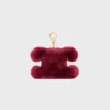 Charm Triomphe con pompón en piel de oveja bordada y piel de becerro