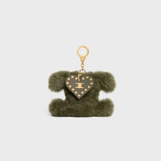 Colgante Triomphe con pompón en piel de oveja y piel de becerro