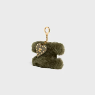 Colgante Triomphe con pompón en piel de oveja y piel de becerro
