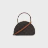 Estuche Half Moon en Triomphe Canvas y piel de becerro Estuche Half Moon en Triomphe Canvas y piel de becerro