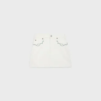 Minifalda bordada en denim blanco con lavado crudo Minifalda bordada en denim blanco con lavado crudo