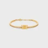Pulsera articulada Triomphe con brillos, en strass y latón con acabado dorado Pulsera articulada Triomphe con brillos, en strass y latón con acabado dorado