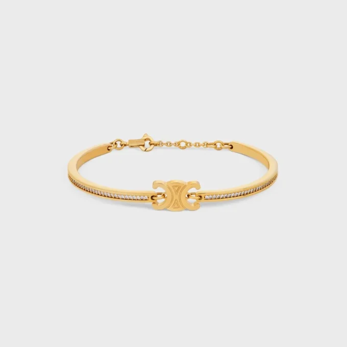 Pulsera articulada Triomphe con brillos, en strass y latón con acabado dorado Pulsera articulada Triomphe con brillos, en strass y latón con acabado dorado