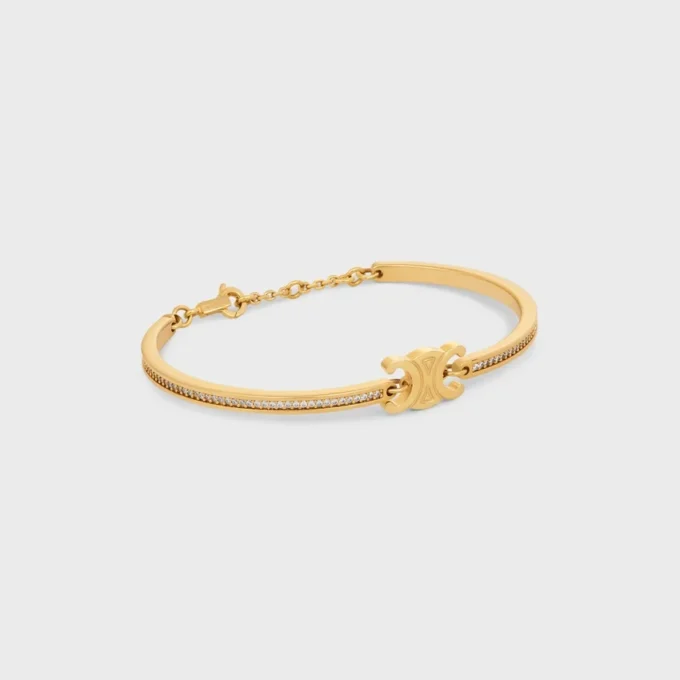 Pulsera articulada Triomphe con brillos, en strass y latón con acabado dorado Pulsera articulada Triomphe con brillos, en strass y latón con acabado dorado
