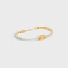 Pulsera articulada Triomphe en esmalte y latón con acabado dorado Pulsera articulada Triomphe en esmalte y latón con acabado dorado