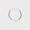 Pulsera con nudo en piel de becerro y latón con acabado de rodio Pulsera con nudo en piel de becerro y latón con acabado de rodio