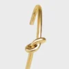 Pulsera extrafina Knot en latón con acabado dorado Pulsera extrafina Knot en latón con acabado dorado