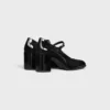 Zapatos CELINE Lily Perforated Triomphe Babies en piel de becerro charol Zapatos CELINE Lily Perforated Triomphe Babies en piel de becerro charol